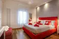 Elegant red double bedroom in Siena historic center apartment